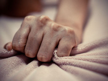 Close-up of woman hand on holding towel