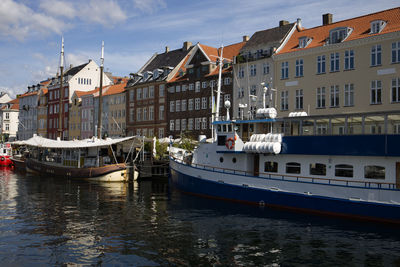 Boats in canal in city