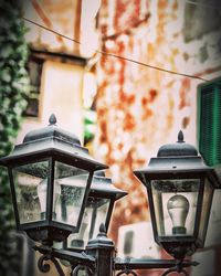 Low angle view of street light against building