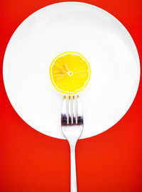 Directly above shot of lemon slice in plate