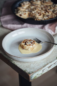 High angle view of cinnamon roll on plate