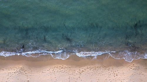 Close-up of wave on beach