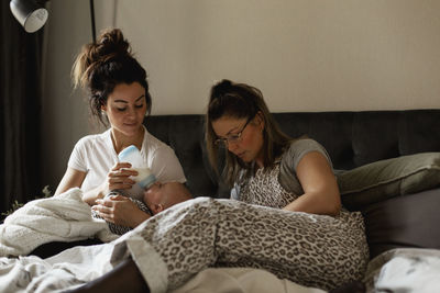 Family on bed with baby