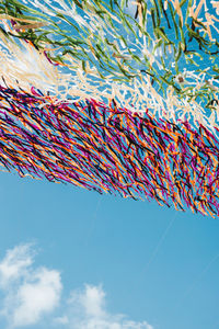 Low angle view of cables against blue sky