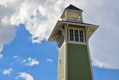 Beautiful victorian lighthouse on cloudy blue skyline, in lake buena vista