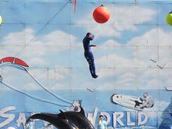 Full length of young woman jumping