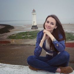 Woman sitting on beach