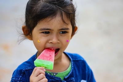 Portrait of cute girl holding ice cream