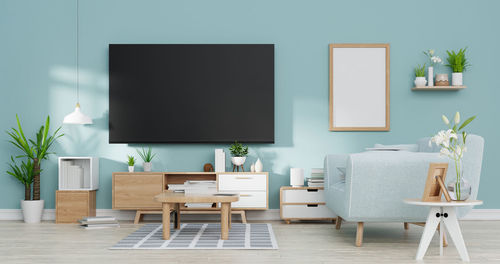 Empty chairs and table against wall at home