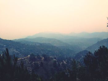 Scenic view of mountains against sky during sunset