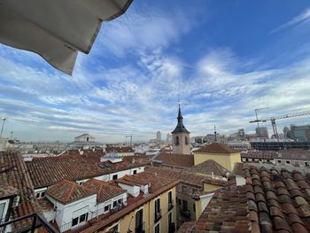 High angle view of buildings in city against sky