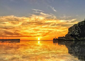 Scenic view of sea against sky during sunset