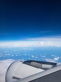 Airplane flying over blue sky