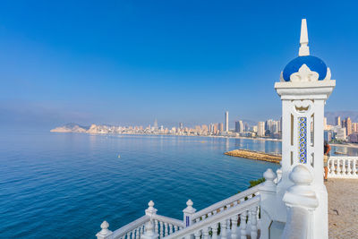 View of sea against clear blue sky