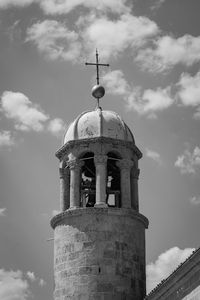 Low angle view of bell tower against sky