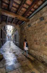 Woman walking in tunnel