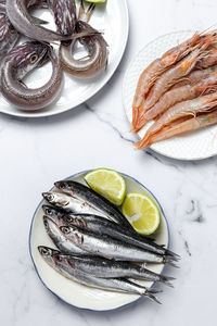 High angle view of fish in plate on table