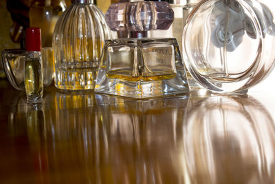 Close-up of perfumes on table
