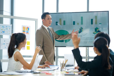 Business colleagues working in office