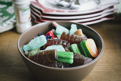 High angle view of candies in bowl on table