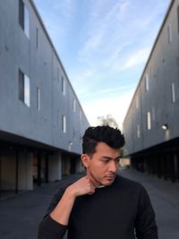 Mid adult man against sky