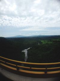 Scenic view of mountains against cloudy sky