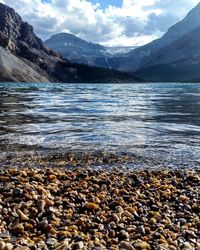 Surface level view of lake with mountains in background