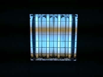 Close-up of window against black background