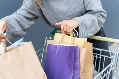 Female holding shopping bags after shopping