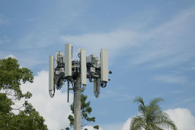 Low angle view of telephone pole against sky