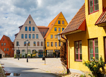 Buildings in city against sky