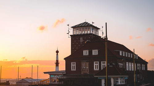 Building against sky during sunset