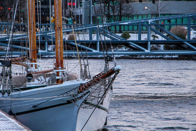 Sailboat moored in sea