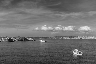 Boats sailing in sea