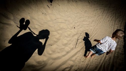 High angle view of people on sand