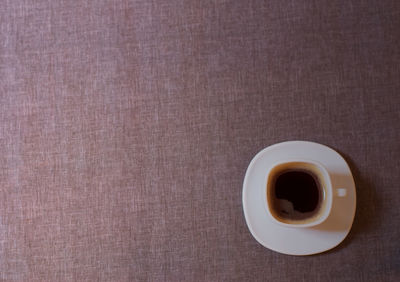 High angle view of coffee cup on table