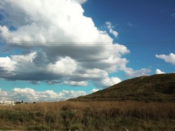 Countryside landscape against blue sky and clouds