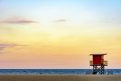 Beach lifeguard cabin at sunset