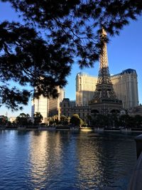 River and buildings against sky