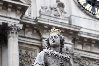 Low angle view of statue against building