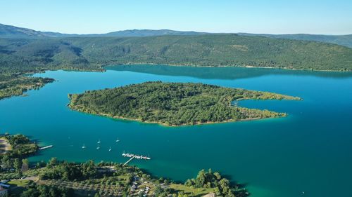 Scenic view of lake and mountains against sky