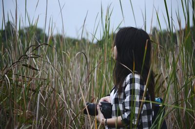 Rear view of woman in field