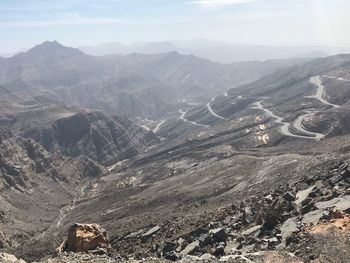 Aerial view of landscape with mountain range in background