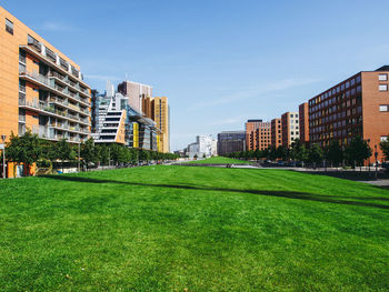 View of buildings in city against clear sky