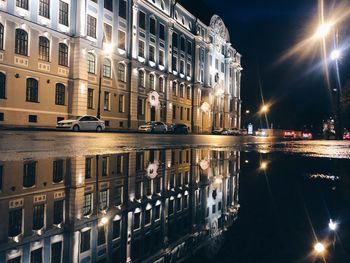 Reflection of illuminated buildings in canal at night