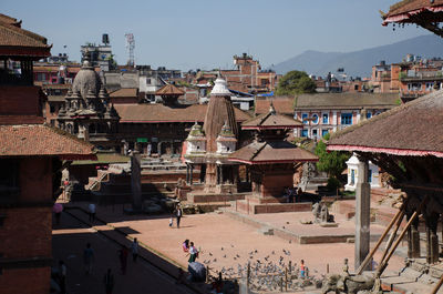 High angle view of people and buildings in city