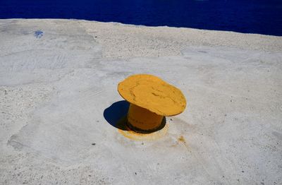 High angle view of yellow umbrella on beach