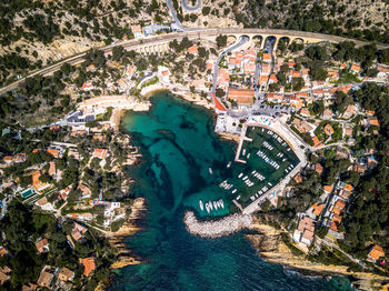 Aerial view of city by sea