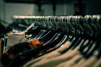 Clothes hanging on coathanger at store