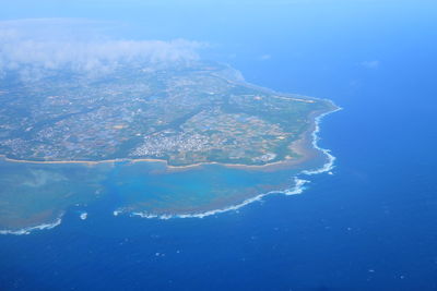 High angle view of sea and island against sky